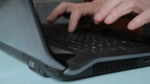 Hands typing on laptop keyboard Stock Footage 99617556