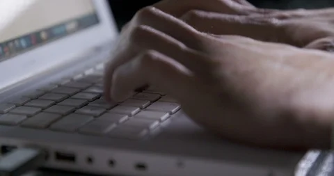 Hands typing on a laptop keyboard Stock Footage 104603848