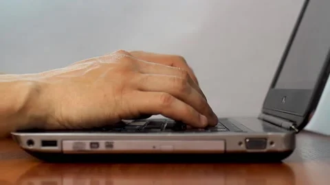 Hands typing on laptop keyboard Stock Footage 133250394