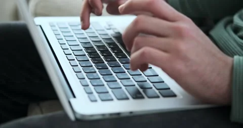 Hands typing on laptop keyboard Stock Footage 156469576