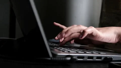 Hands typing on a laptop keyboard Stock Footage 264850389