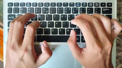 Hands typing on laptop keyboard Stock Footage 291908976