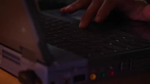 Hands Typing on a Laptop Keyboard in Low Light Stock Footage 310325023