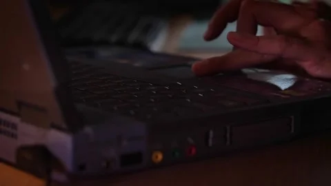 Hands Typing on a Laptop Keyboard in Low Light Stock Footage 310325032