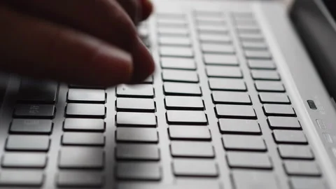 Hands typing on laptop keyboard, man working on pc in office Stock Footage 209235974