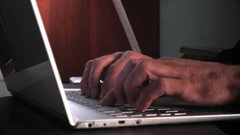Hands typing laptop keyboard. Studying home sitting at computer Stock Footage 196198171