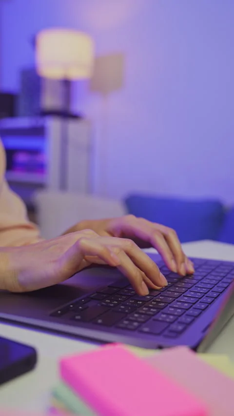 Hands typing on laptop keyboard on table, remote working. Stockbeeldmateriaal 335804583
