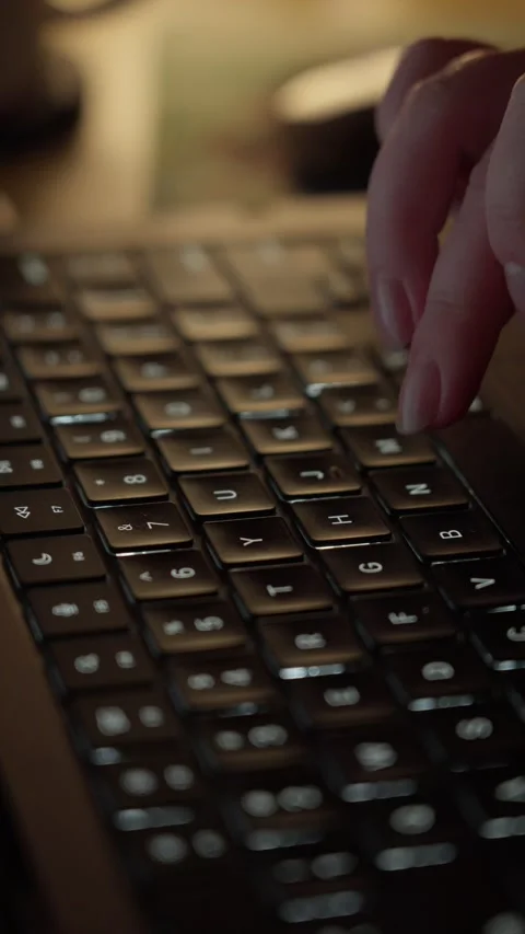 Hands Typing on Laptop Keyboard in Warm Light Close Up Stock Footage 344950451