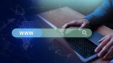 Hands typing on laptop keyboard while searching the web with digital graphics Stock Photos