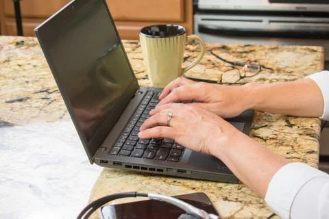 Hands typing on laptop Stock Photos