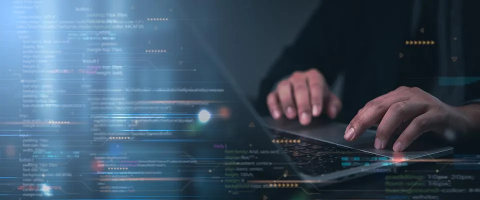 Hands typing on laptop with programming code on screen, representing softwa.. Stockfoto's