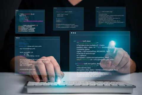Hands typing on laptop with programming code on screen, representing softwa.. 库存照片