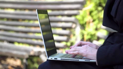 Hands typing on laptop for remote digital nomad work outdoors with copy space Stock Footage 333119106
