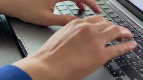 Hands typing on laptop — remote work and digital communication Stock-Footage 319655595