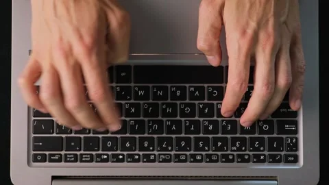 Hands typing on laptop top view close up work process minimal desk Stock Footage 315118620