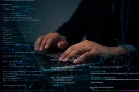 Hands typing on a laptop with visible coding and encryption data, represent.. Foto stock