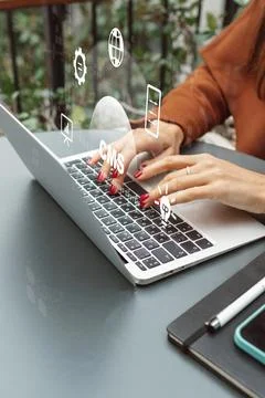 Hands typing on laptop while interacting with a content management system Stock Photos