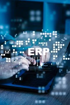 Hands typing on laptop while working with ERP software in a modern office Stock Photos