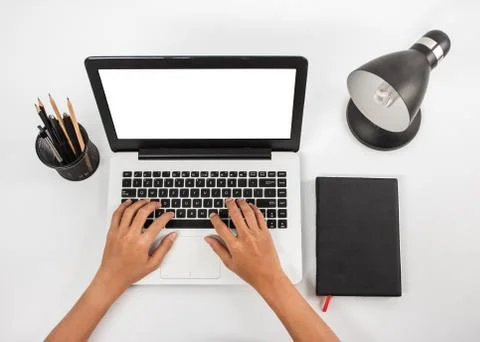Hands typing on laptop at working space 스톡 사진