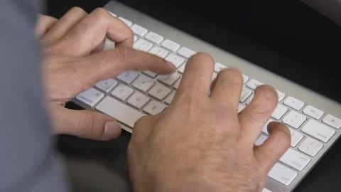 Hands typing on a mac keyboard Stock Footage 85177897