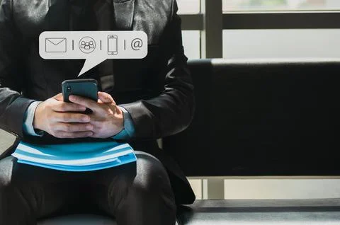 Hands typing on mobile phone, tablet computer with communication contact icon Stock Photos