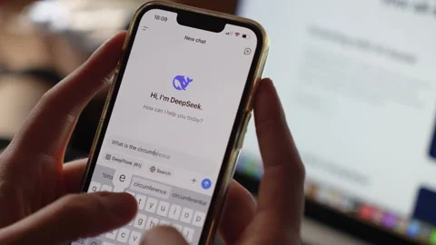 Hands typing a question into AI chatbot app Stock Footage 304170822