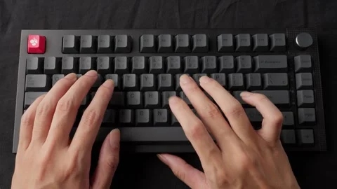 Hands typing rapidly on a mechanical keyboard, clear audible clicks, focus Stock Footage 268809482