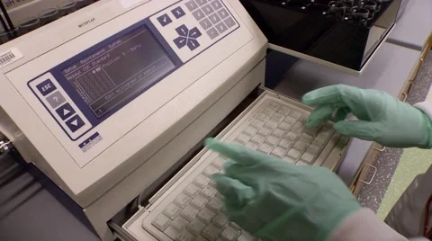 Hands Typing on Scientific Laboratory testing equipment Stock Footage 55574717