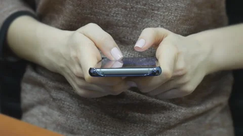 Hands typing on smartphone Stock Footage 61887069