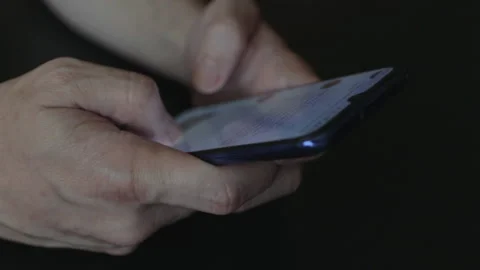 Hands typing on a smartphone. Stock Footage