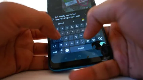 Hands Typing on Smartphone Keyboard, Close-up of hands typing on a smartpho.. Stock Footage 317736674