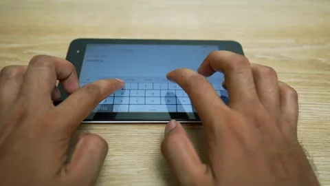 Hands Typing on Tablet with Virtual Keyboard Stock Footage 320725218