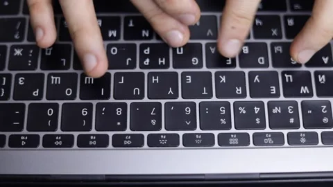 Hands typing text on keyboard under white light Stock Footage 229706378