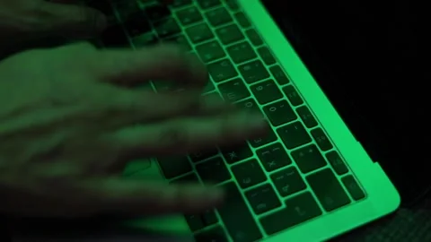 Hands typing text on laptop with green light frame side view Stock Footage 229706298