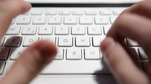 Hands typing text on a laptop keyboard Video stock 34933477