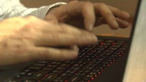Hands typing text on a laptop keyboard. Video stock 127418322