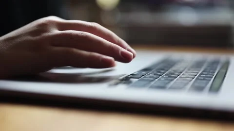 Hands typing text on the laptop keyboard. Remote work at home, business, study 動画素材 194357000