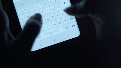 Hands typing text on smartphone close-up. Using smartphone close up at night. Video stock 128798073
