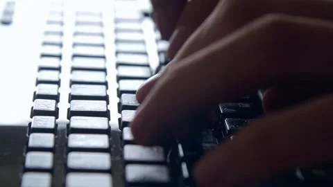 Hands typing text on wireless keyboard - extreme close up slow motion Stock Footage 131431289
