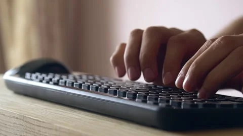 Hands typing text on wireless keyboard and doing click with mouse slow motion Stock Footage 131431360