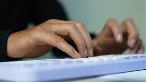 Hands typing on a white computer keyboard, showing focused work, online com.. Stock Footage 345119095