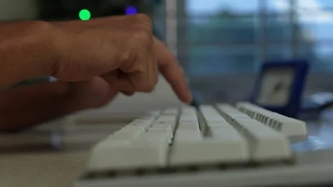 Hands Typing on White Computer Keyboard, Close-up of hands typing on a whit.. Stock Footage 345119242
