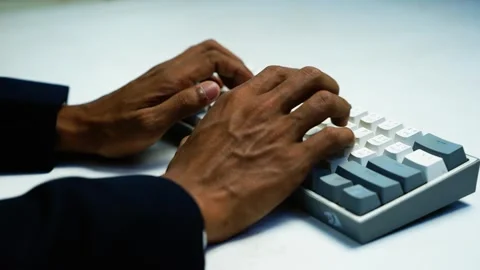 Hands Typing on a White Computer Keyboard, Close-up of a person's hands typ.. Stock Footage 348344974