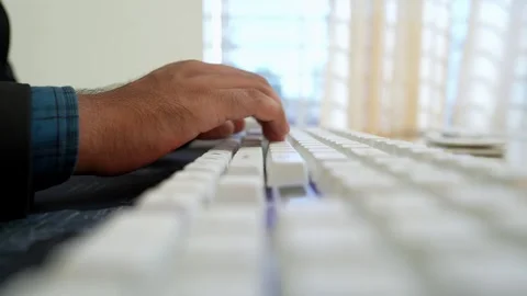 Hands Typing on White Keyboard in Bright Office Stock Footage 320725846