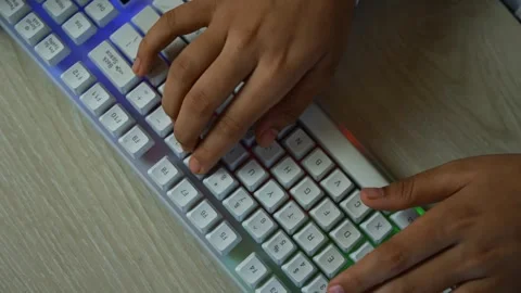 Hands Typing on White RGB Mechanical Keyboard, Close-up of hands typing on .. Vídeo Stock 329177300