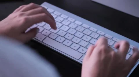 Hands Typing on wireless keyboard Stock Footage 46308782
