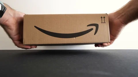 Hands unboxing Amazon Prime Day cardboard parcel Stock Footage 95207981