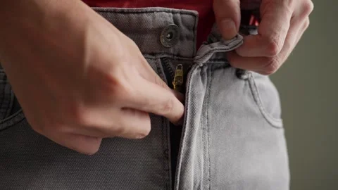 Hands Unbutton Unzip Gray Jeans Pants, Getting Undressed, Close Up Stock Footage 276083716
