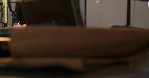Hands Unfold Sheet of Leather on Desktop, Close-up of Roll of Leather, Craftsman Stock Footage 129566213