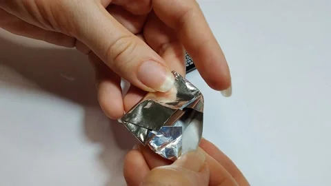 Hands unfolding small milk chokolate bar Stock Footage 156673455